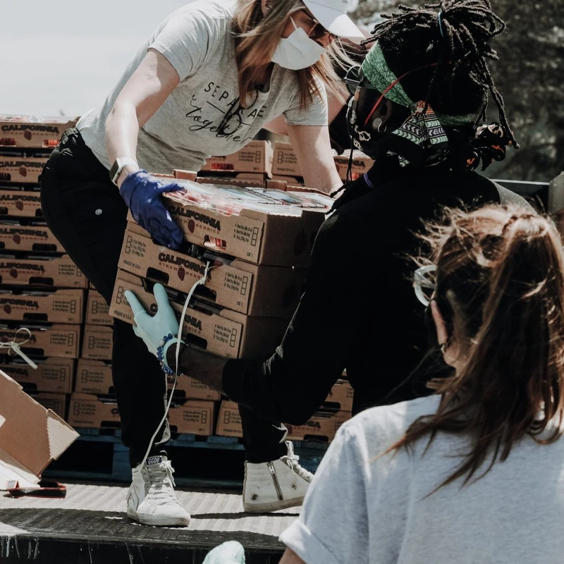 New Life volunteers distributing food to the community